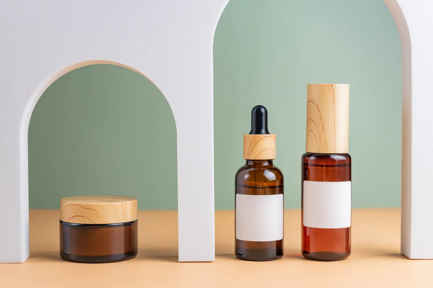 Elegant cosmetic products arranged in a minimalist setting