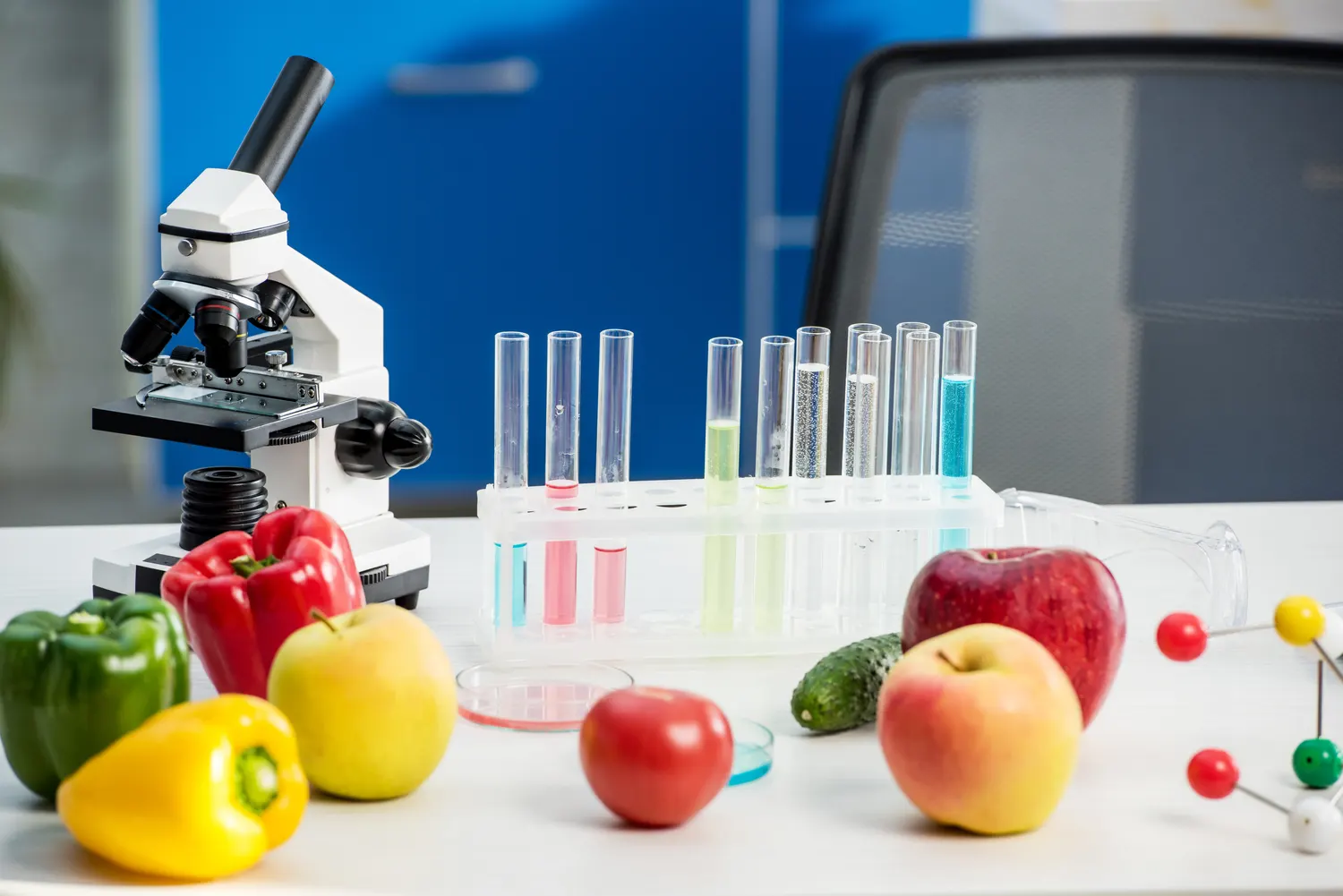 Fresh produce examined with a microscope and test tubes in a lab